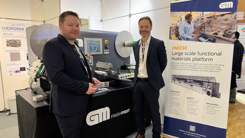 Uffe and Tobias in front of a GM´s PilotCoat at LOPEC 2023